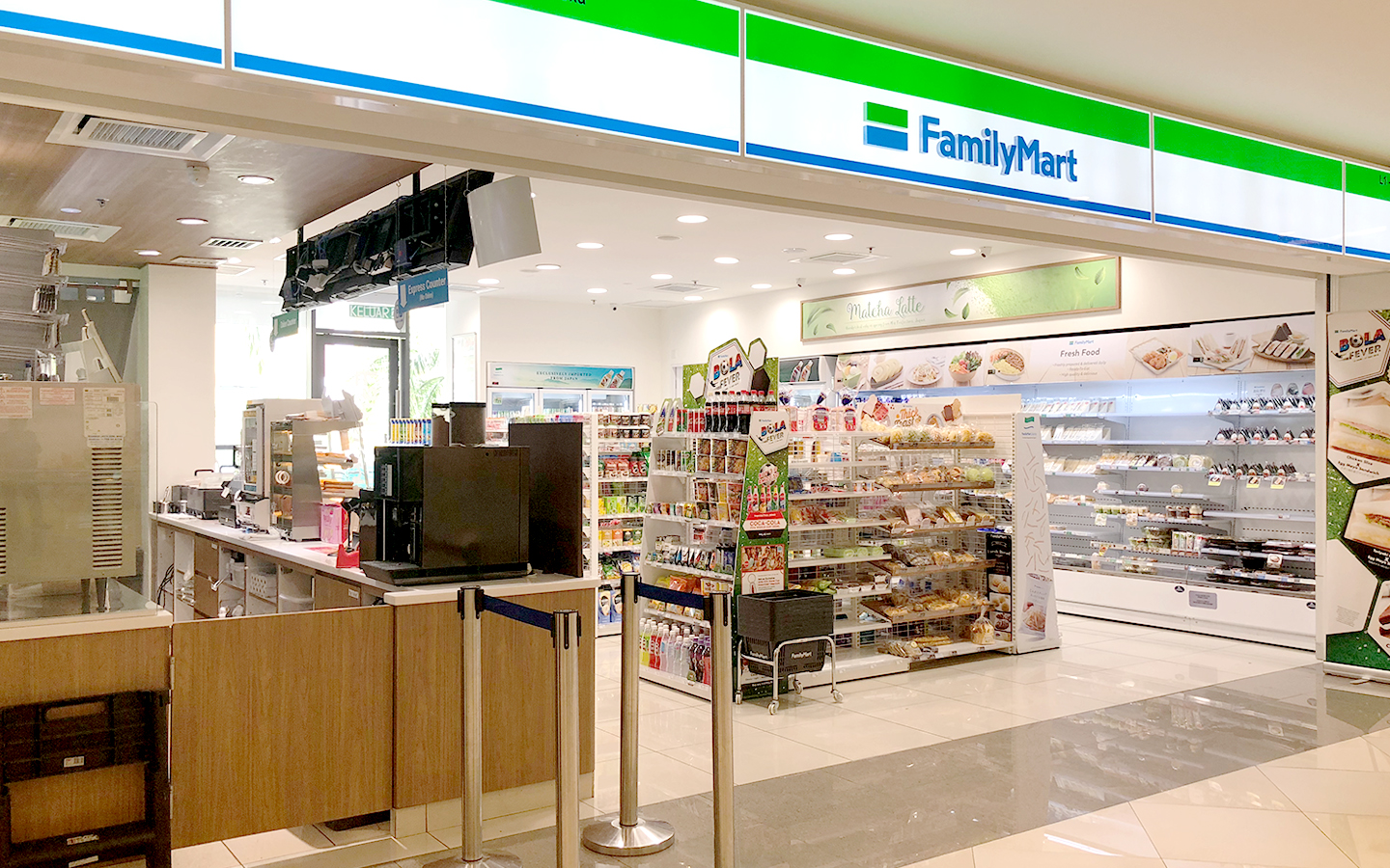 The recognizable FamilyMart storefront, a successful retail venture by QL Resources.