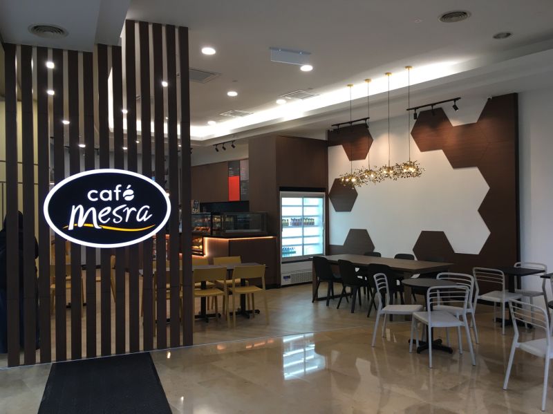 The inviting interior of a Café Mesra, a key part of Petronas's strategy to enhance customer experience.